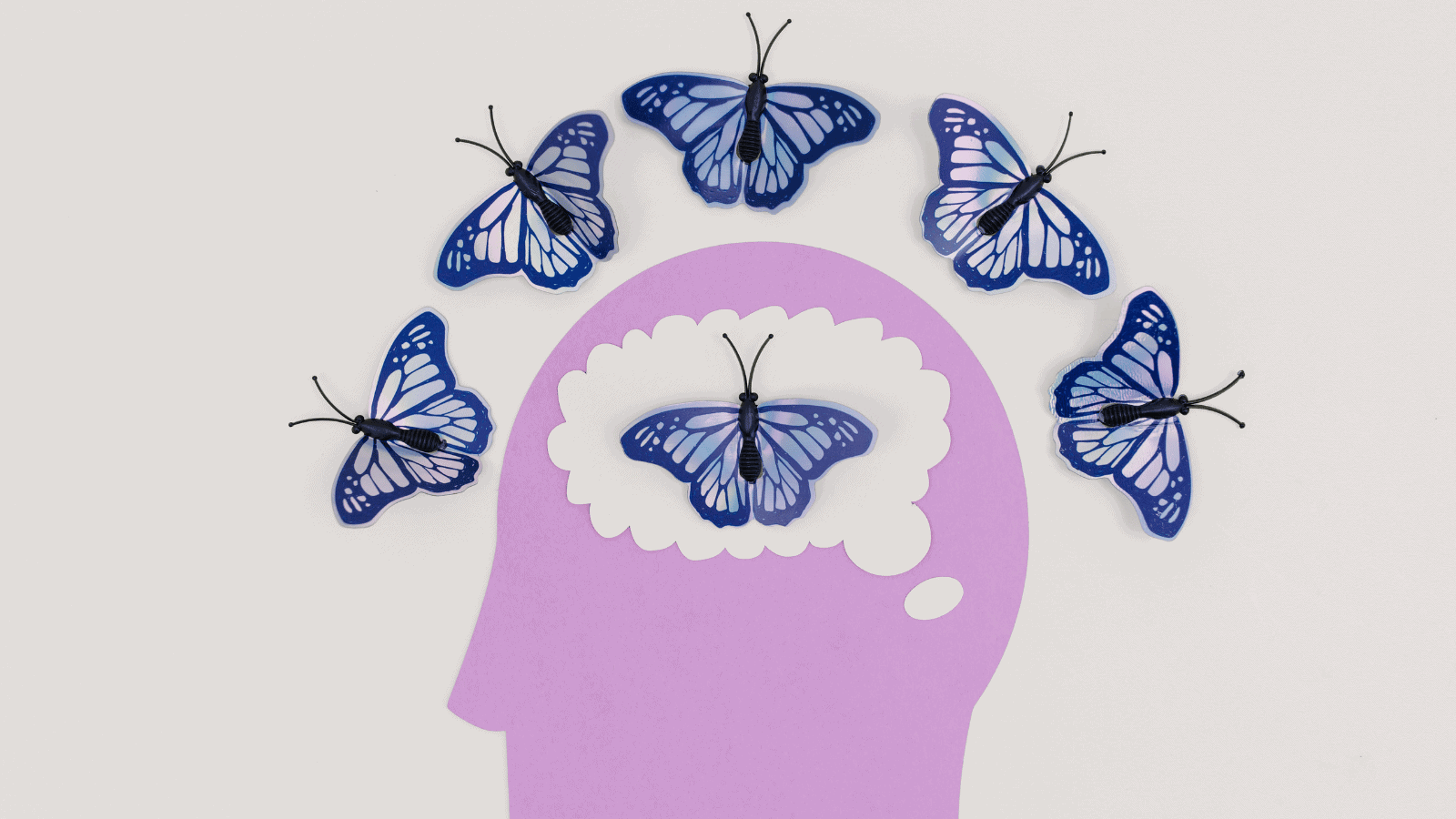 Human head with butterflies surrounding it symbolizing new life